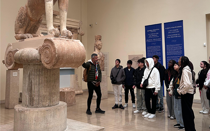 Students being educated on historical artefacts in a museum in Greece
