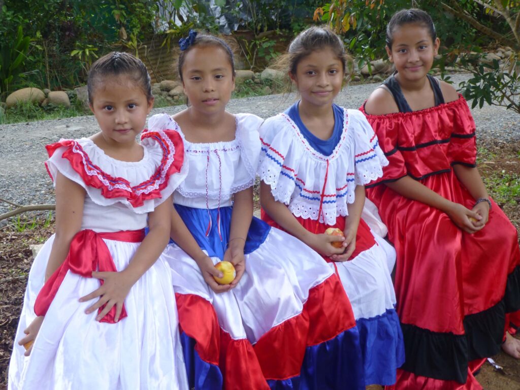 group of local girls dressed in traditional dresses in Costa Rica