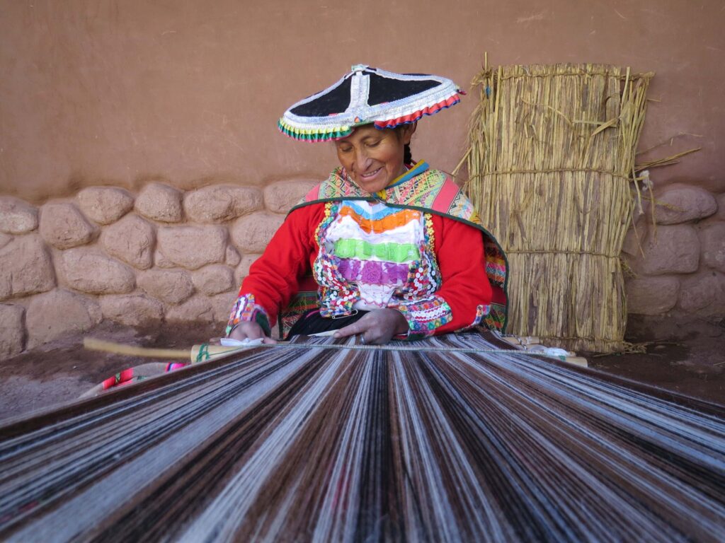 Local woman in Peru weaving traditional crafts