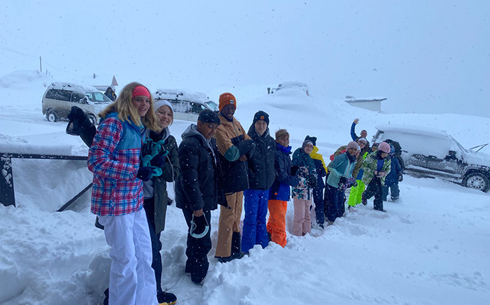 Students lined up and stood in the snow on their ski trip in Georgia