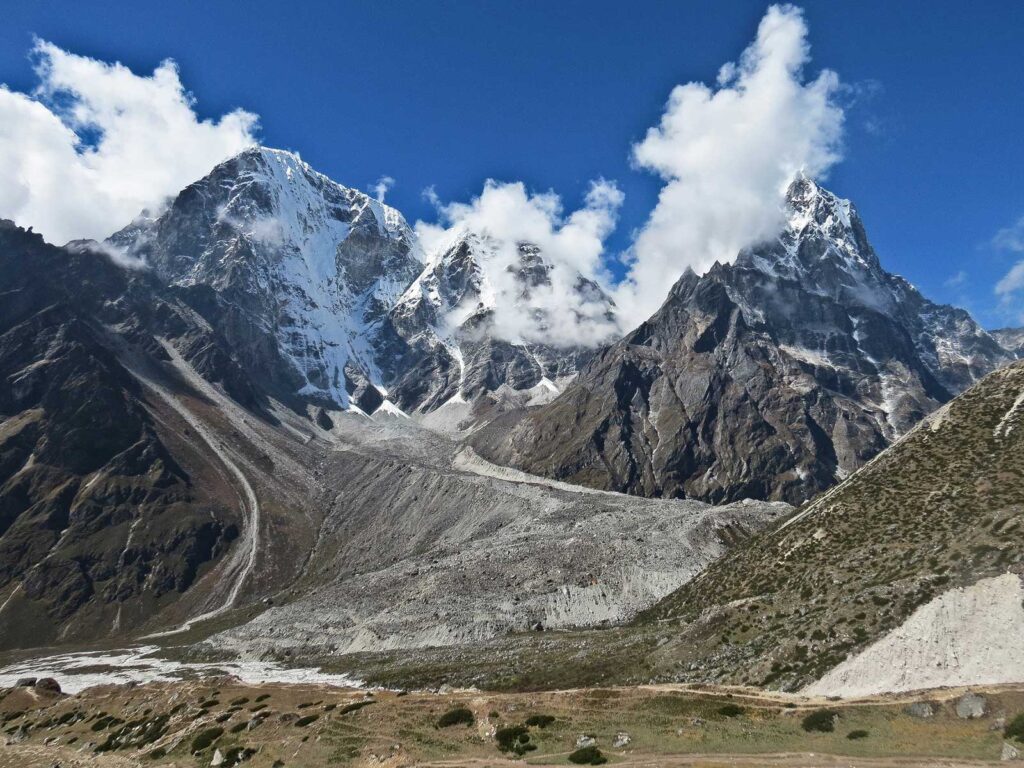 Mountain in Nepal on a sunny day with blue skies and clouds