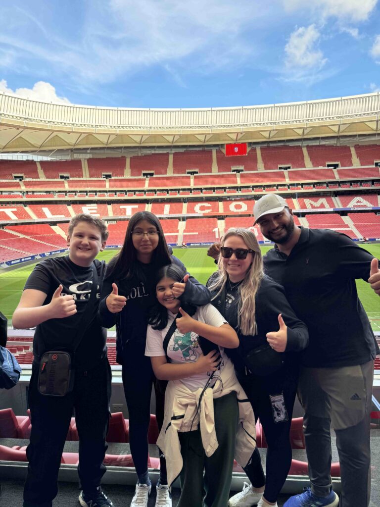 A family of 5 posing inside the Wanda Metropolitano.