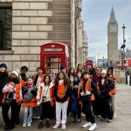 Group of students in with the iconic red phone booth and the Big Ben behind them.